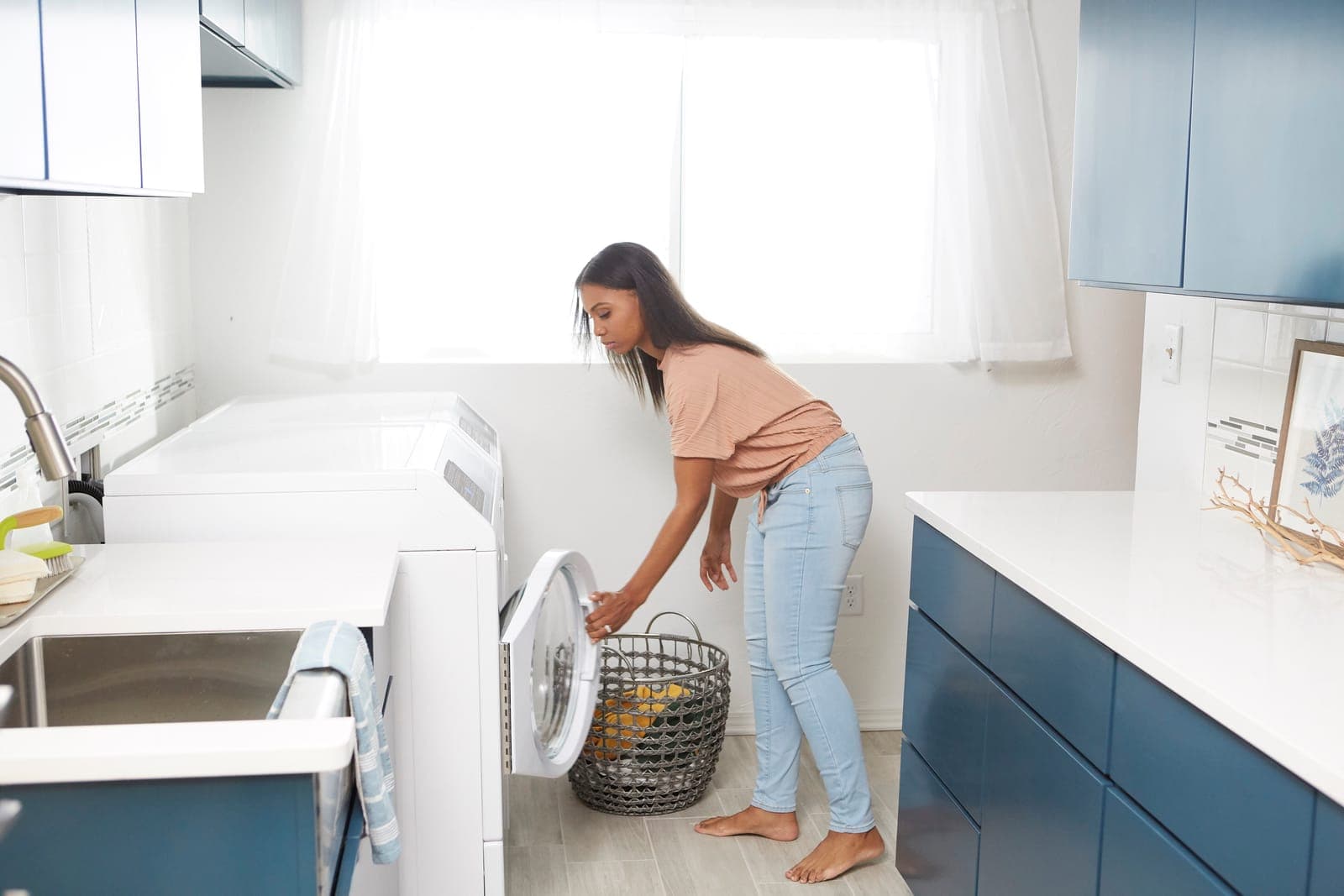 Speed Queen FF7 washer and DF7 dryer pair in a laundry room